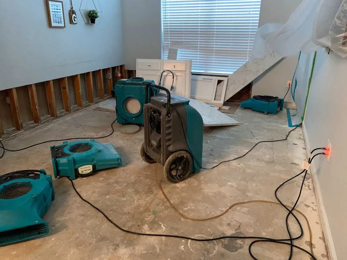 Dehumidifier in flood-cut room for Water Damage Restoration in Mack